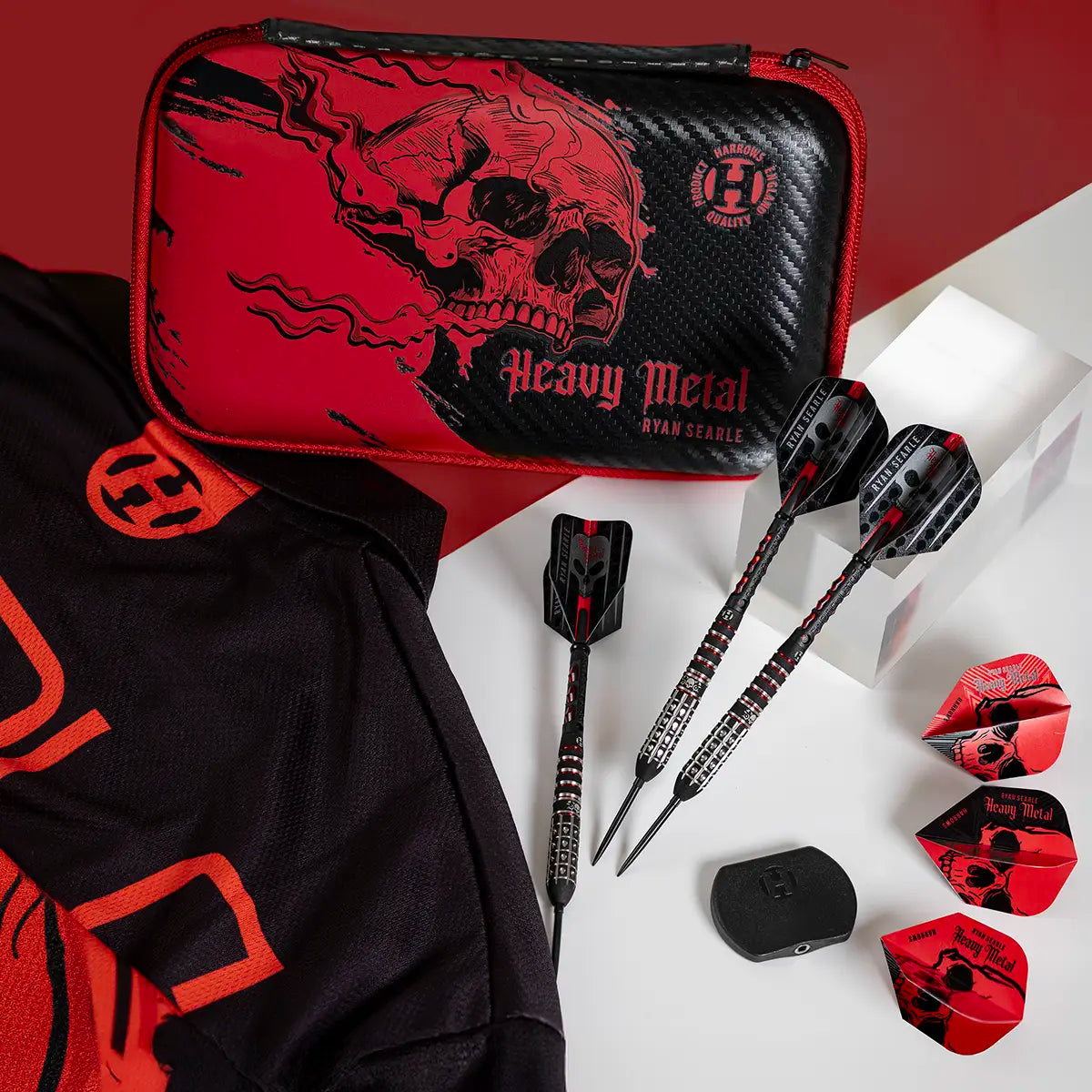 Ryan Searle Black and red dart set with skull design on a white surface with accessories