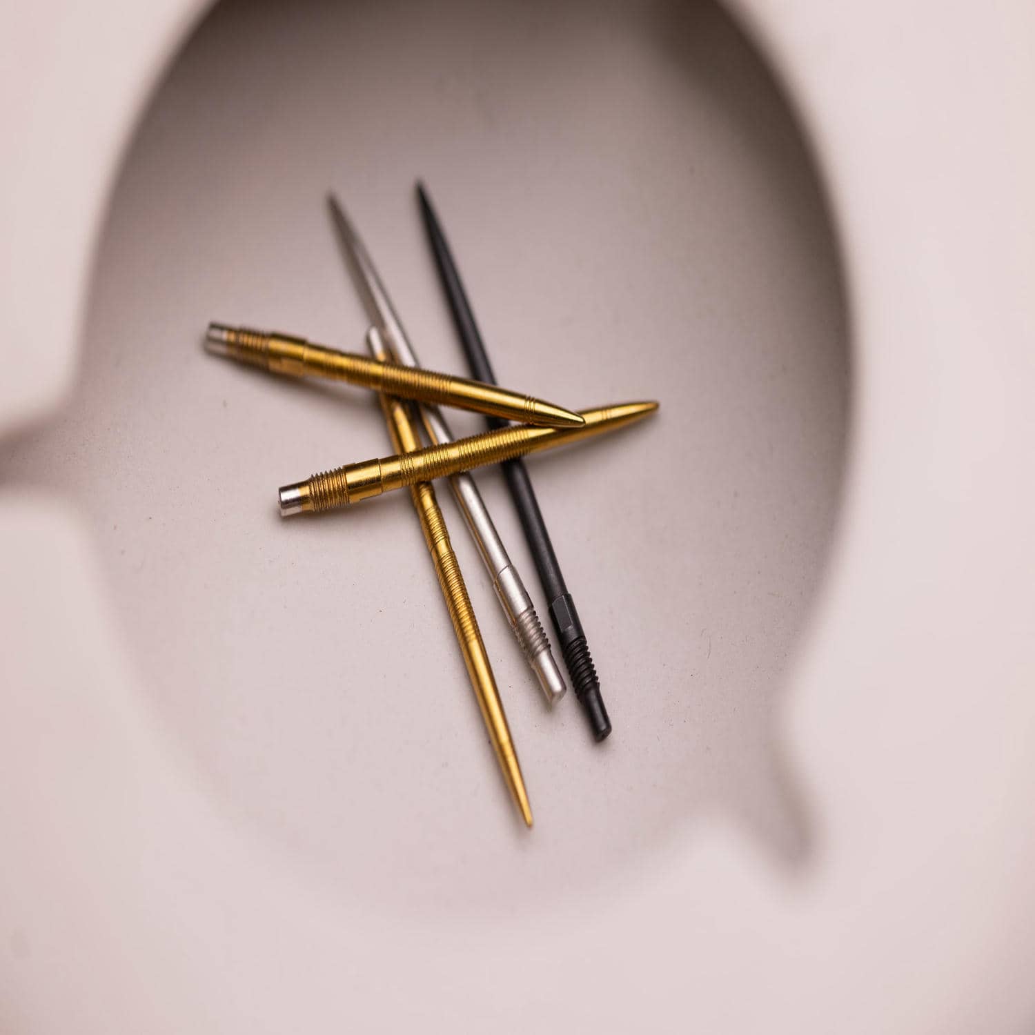 Image of black, gold and silver quick point accessories