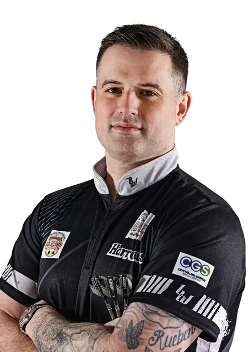Luke Woodhouse wearing a black Harrows players shirt with logos on a white background