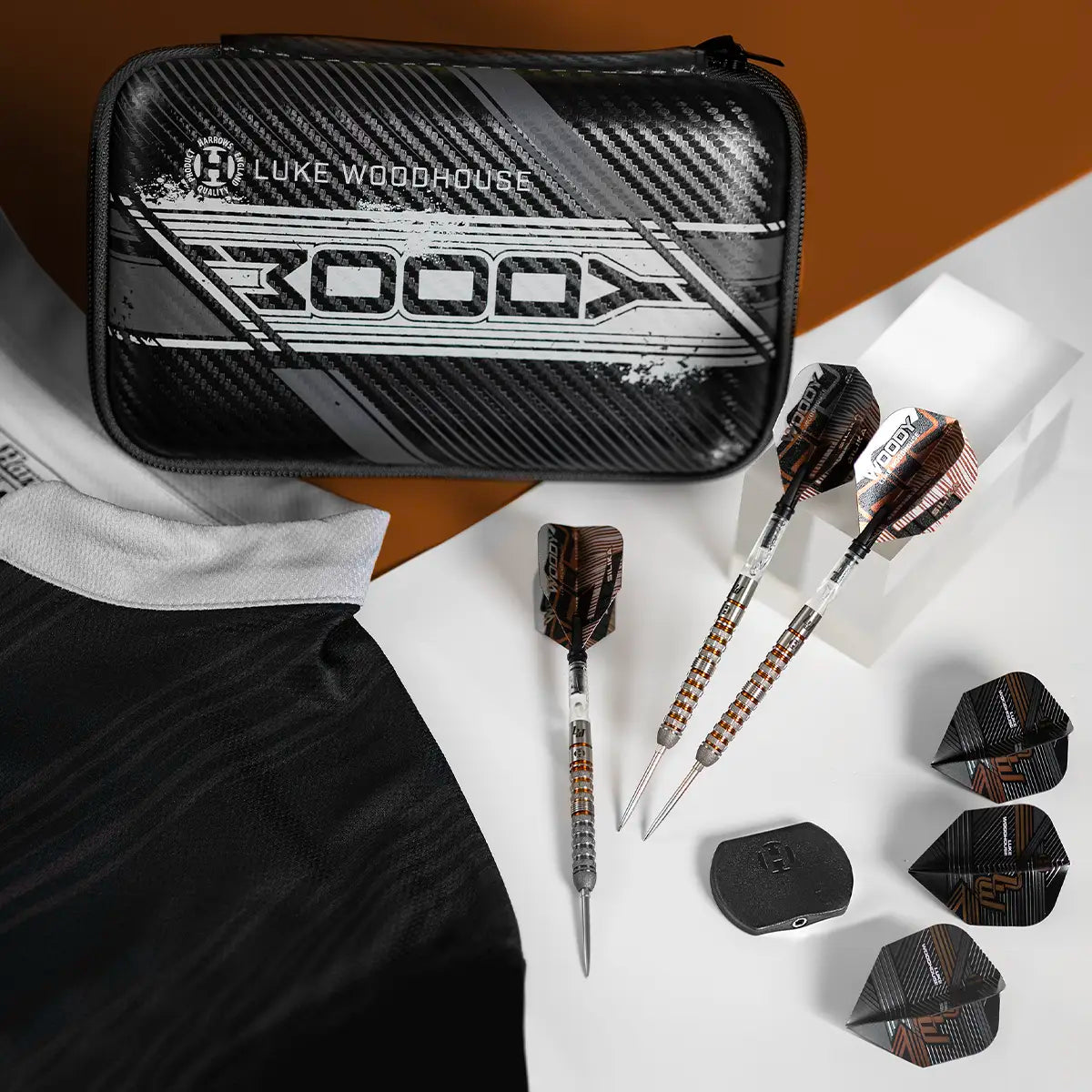 Luke Woodhouse Dart case with darts and dart flights on a white surface
